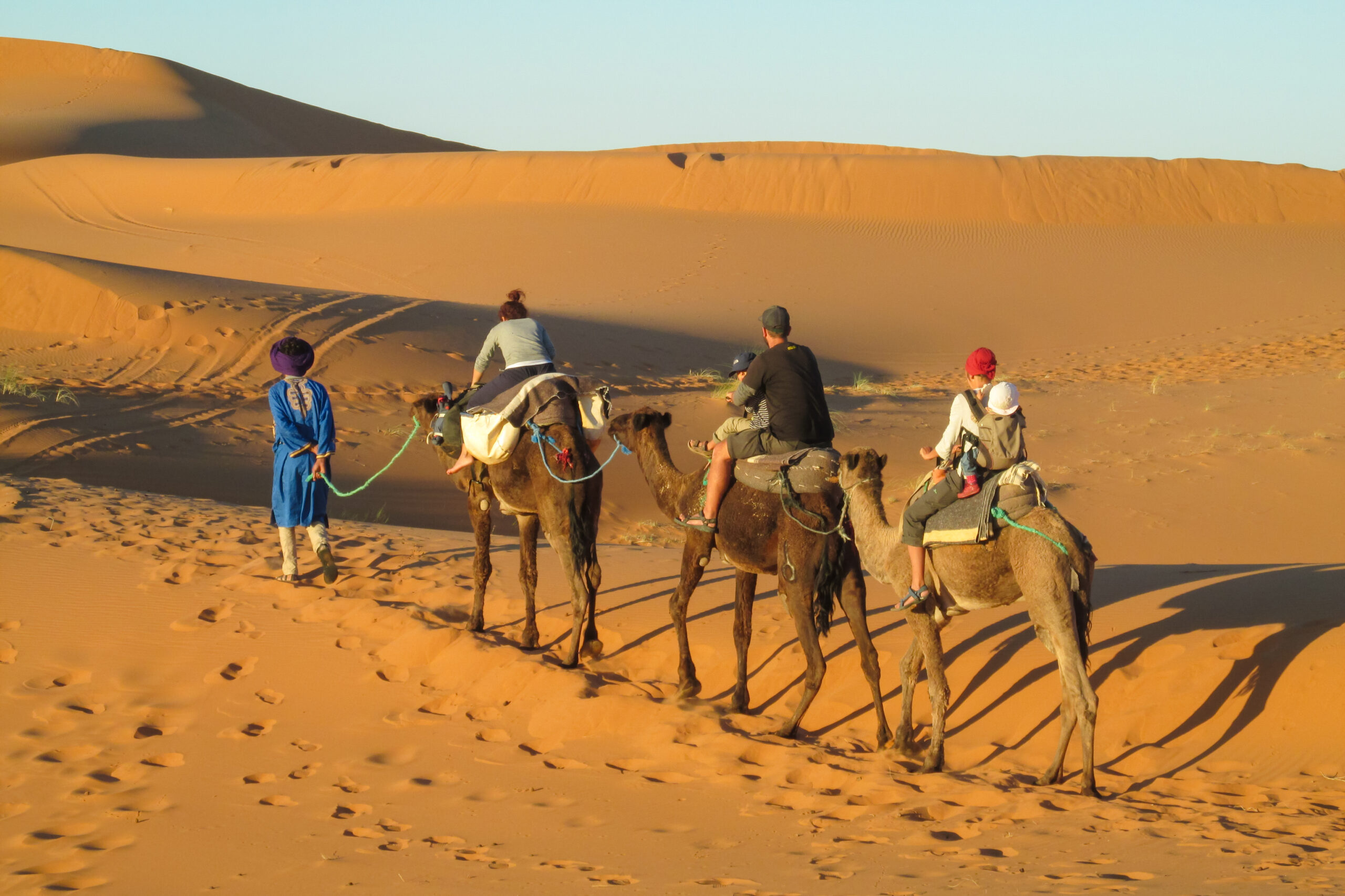 Family-friendly tours Morocco – parents and children exploring a colorful Moroccan medina together