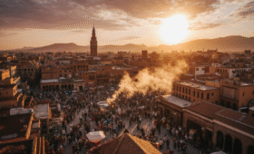 Jemaa el-Fna square Marrakech at sunset with Koutoubia Mosque - top Marrakech attractions and points of interest