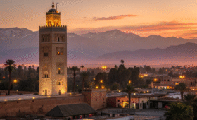 Marrakech nightlife skyline at sunset with Koutoubia Mosque and illuminated city lights showcasing evening entertainment options