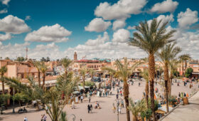 Aerial view of Marrakech Medina UNESCO World Heritage site with traditional souks and salmon-pink walls at sunset