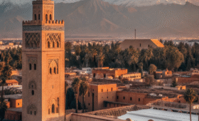 Aerial view of Marrakech Morocco with Koutoubia Mosque and Atlas Mountains showing the city's geographical location in central Morocco , where is marrakech