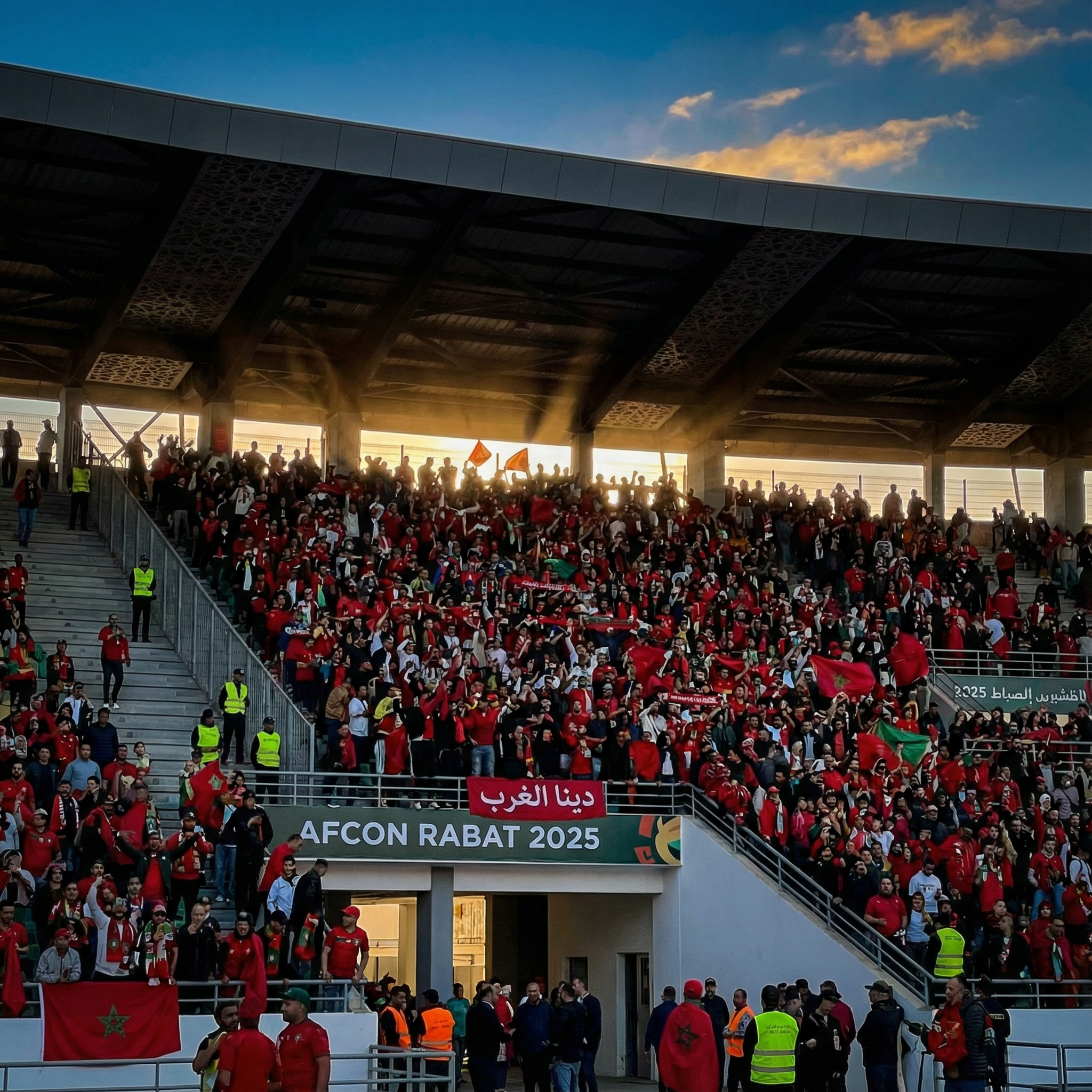 Enthusiastic crowd entering the Kop stand at Rabat Stadium AFCON in Rabat, with afcon match day tips on timing, weather prep, and prohibited items for the Prince Moulay Abdellah venue, inspiring safe enjoyment of Morocco's football passion