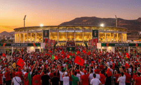 Exciting Agadir Stadium AFCON venue in Morocco for TotalEnergies CAF AFCON 2025, fans gathering for group-stage matches, blending coastal city vibes with thrilling football atmosphere, ultimate travel guide inspiration for international supporters.