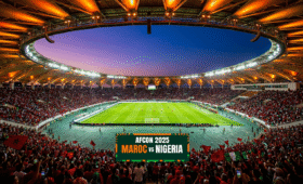 Aerial view of Rabat Stadium AFCON buzzing with fans during Morocco's match, showcasing the modern 68,700-seat venue in Rabat with its unique roof design and passionate crowd atmosphere, perfect for AFCON travelers seeking how to get there and parking info