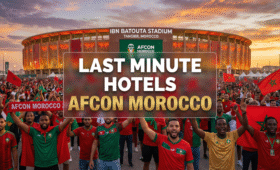 Excited AFCON fans gathering near Ibn Batouta Stadium in Tangier for Round of 16 matches, highlighting last minute hotels afcon options in Morocco for affordable stays during the 2025 Africa Cup of Nations, vibrant Moroccan football atmosphere