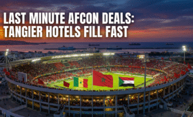 Exciting AFCON 2025 Round of 16 action at Grand Stade de Tangier, fans waving flags for Senegal vs Sudan match, ideal for last minute hotels AFCON bookings in Morocco's vibrant coastal city, capturing the thrill of knockout stage soccer tourism