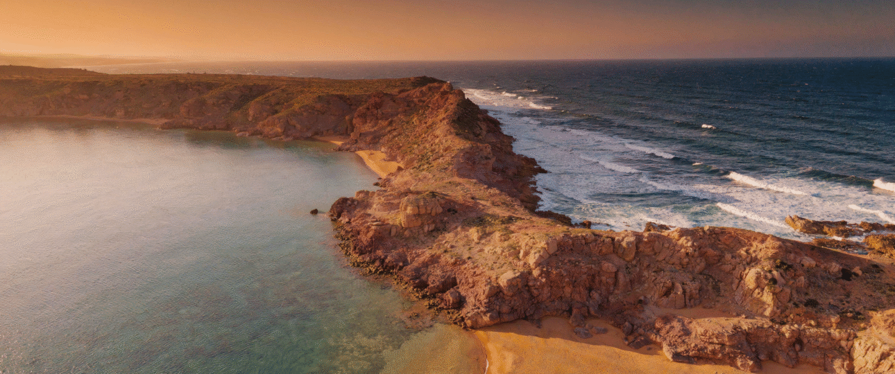 Are Morocco beaches swimmable? Aerial view of Mediterranean and Atlantic coastline showcases safe swimming conditions at Morocco sea beach with golden hour light