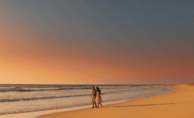 Morocco beach weather guide- panoramic sunset view of Agadir beach with warm golden light, perfect coastal climate for your Morocco travel planning.