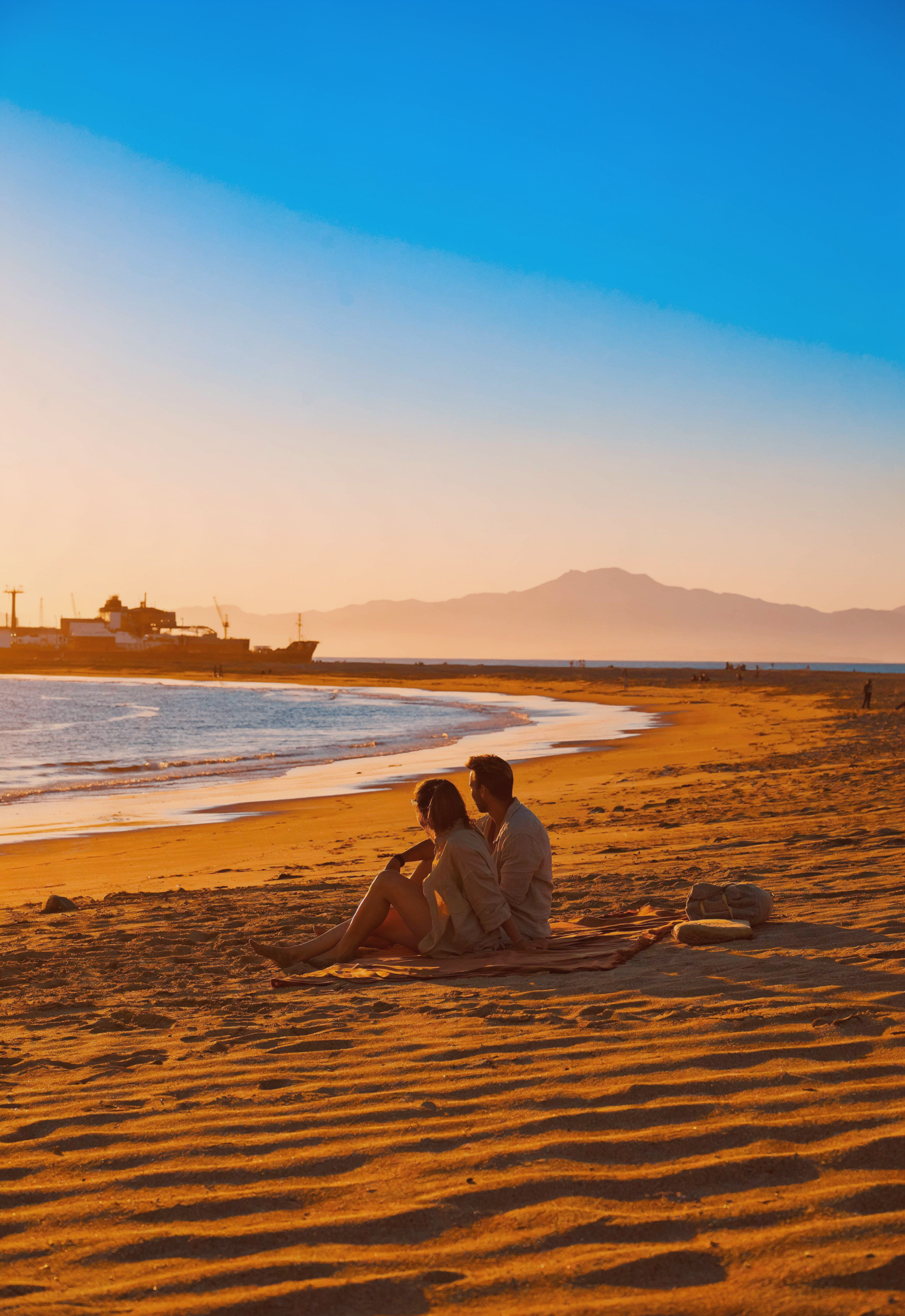 Tangier Morocco city beach Plage de Tanger at sunset with golden sand and Strait of Gibraltar view, best tangier morocco beach for convenient access from medina