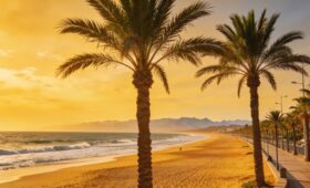 Agadir Morocco beach panoramic view golden hour Atlantic coast palm trees promenade La Corniche Atlas Mountains perfect holiday destination