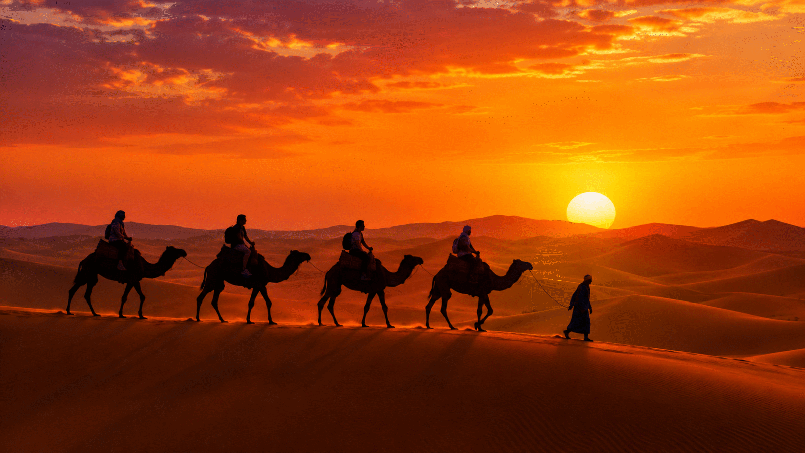 Best morocco travel packages tours for dream vacation - golden sunset camel trek in Sahara Desert near Merzouga, travelers riding camels across Erg Chebbi dunes