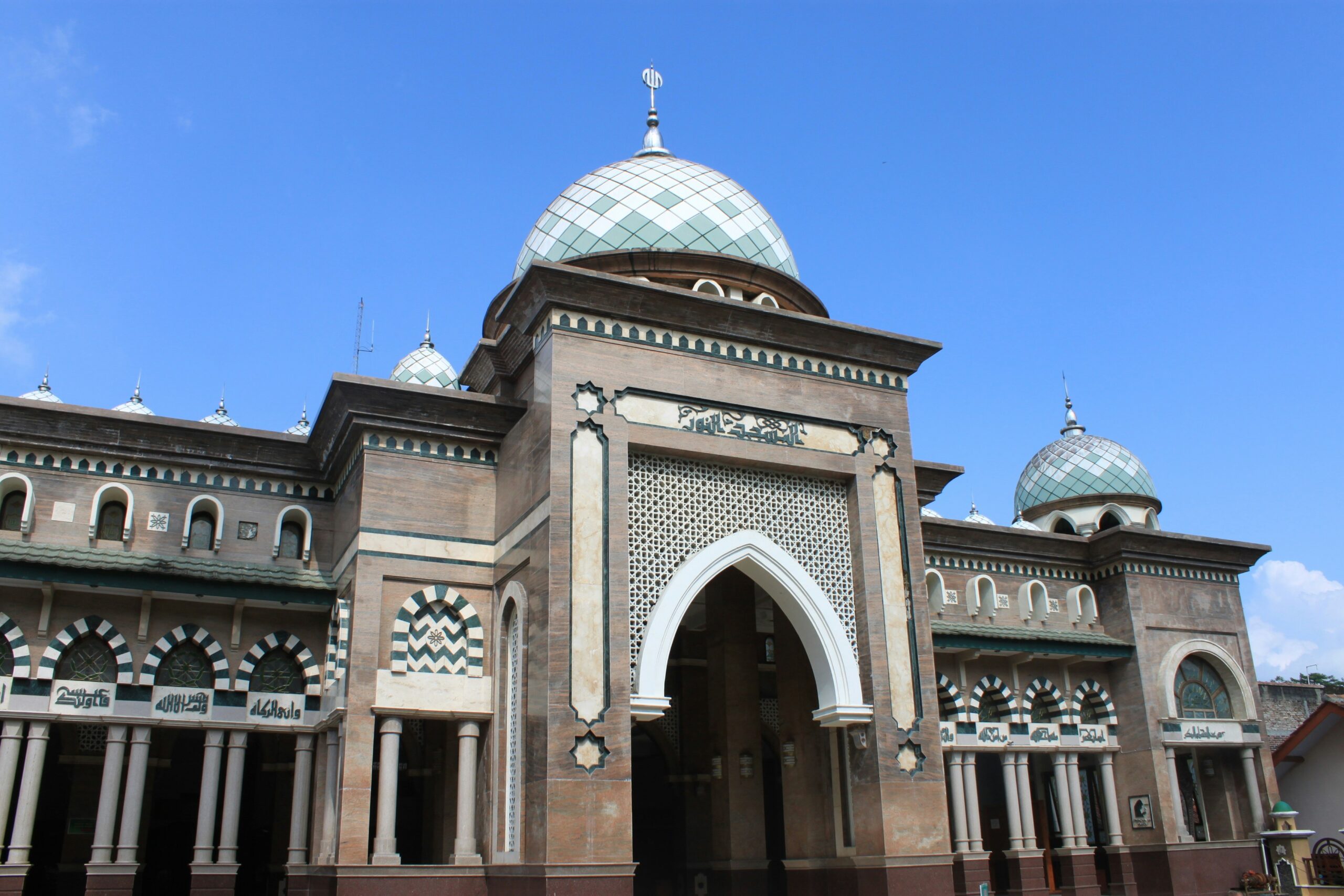 Bou Inania Madrasa interior courtyard with carved stucco walls and zellige tilework in Fes