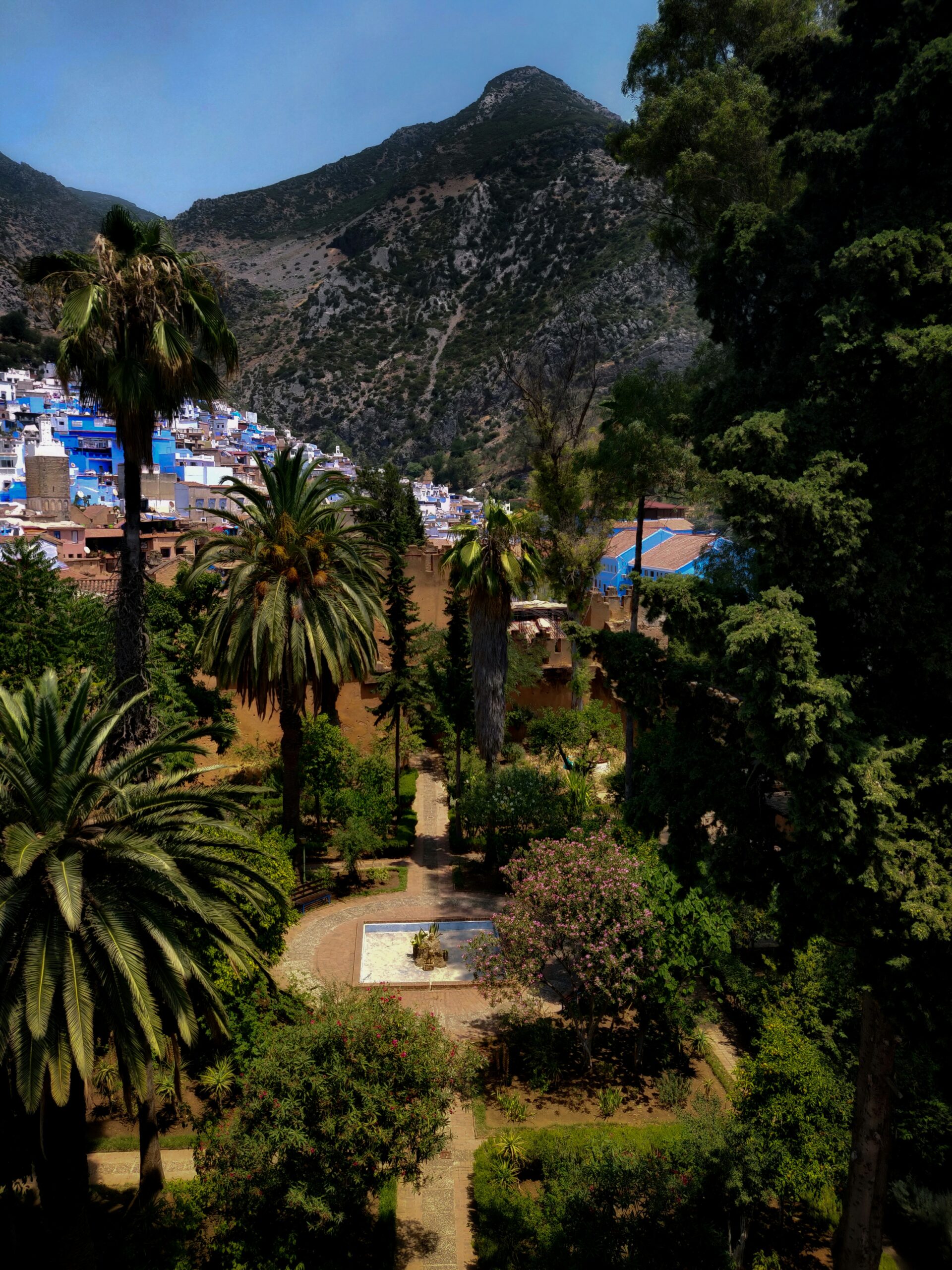 Aerial view of Chefchaouen blue city against the Rif Mountains of northern Morocco