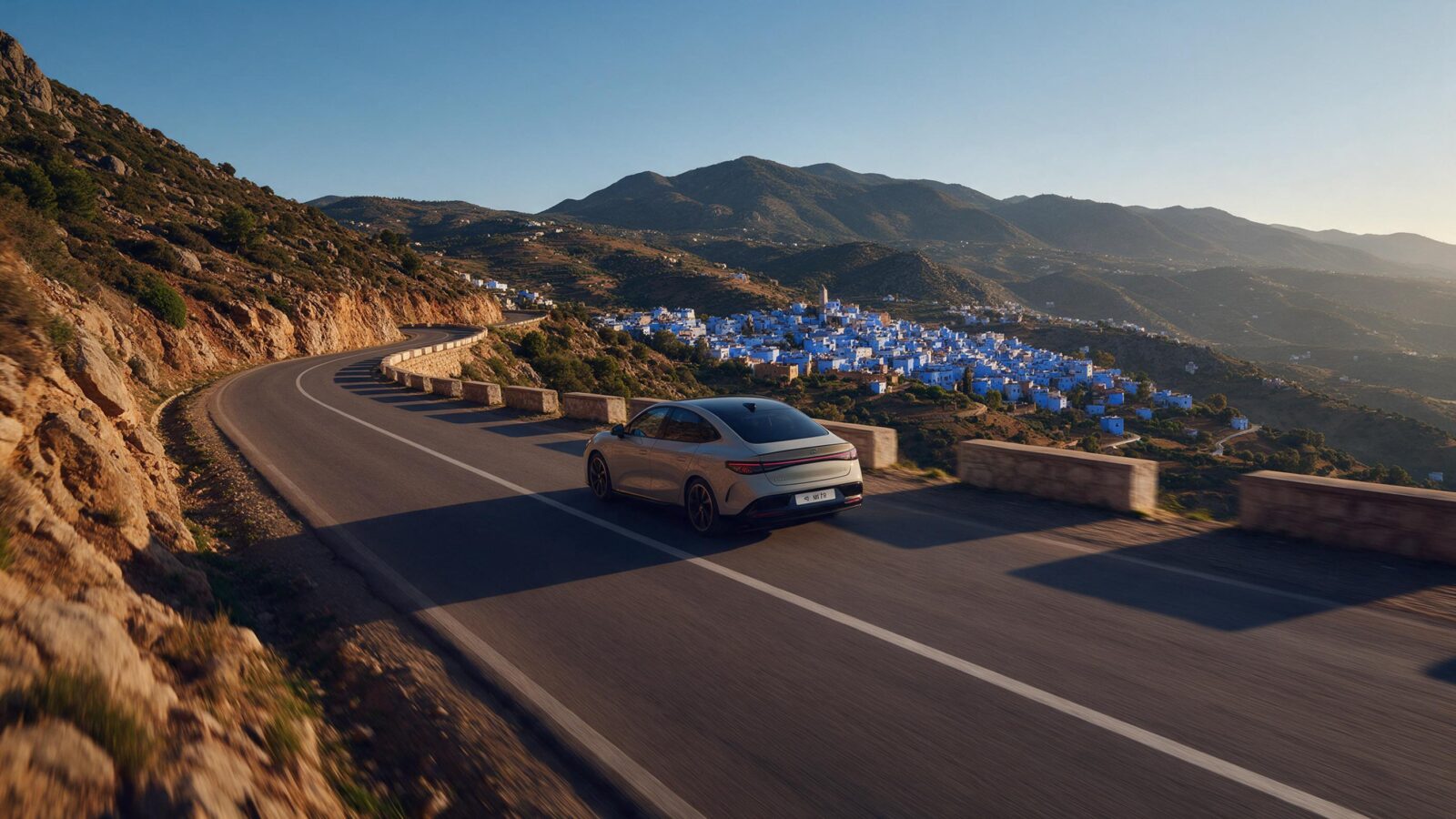 Private transfer Tangier to Chefchaouen – scenic drive through Rif Mountains with blue city in distance, seamless port-to-mountain journey for Morocco travelers.